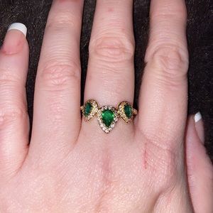 Size 8.5 18k gold plated ladies ring with emerald crystals